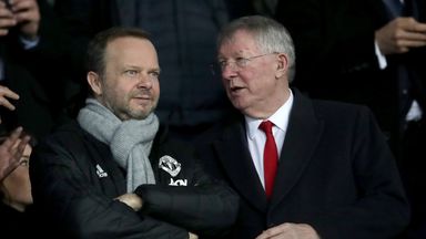 Mr Woodward (left) is pictured in the stands with Sir Alex Ferguson in 2019
